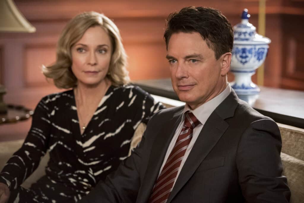 Arrow Season 8 Episode 1 - Susanna Thompson as Moira Queen and John Barrowman as Malcolm Merlyn