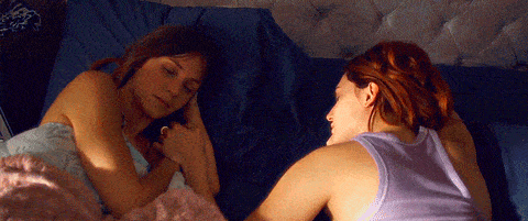 Dominique Provost-Chalkley as Waverly Earp and Kat Barrell as Nicole Haught on Wynonna Earp