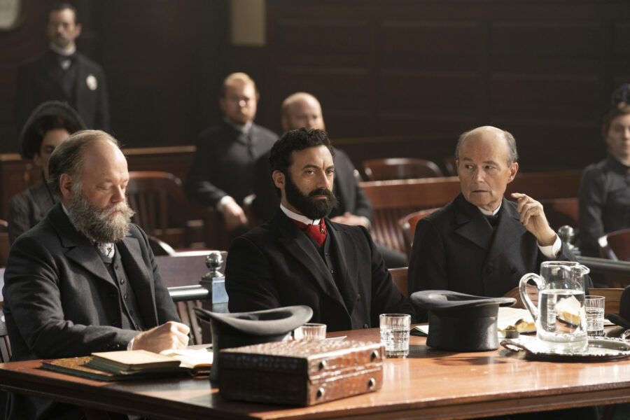 The Gilded Age Season 1 Episode 8 - Morgan Spector | Tell-Tale TV George Russell sitting in court in The Gilded Age Season 1 Episode 8, "Tucked Up in Newport"