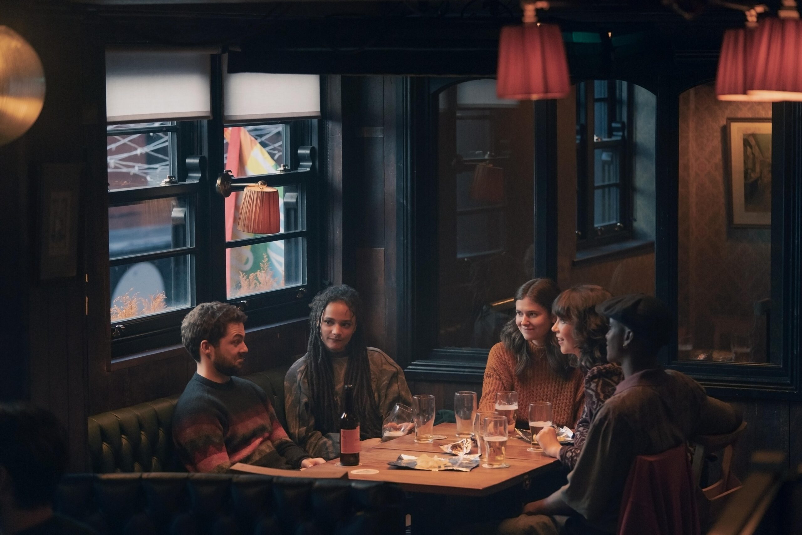 Conversations with Friends - Season 1 Episode 11 | Tell-Tale TV Philip, Bobbi, Frances, Aideen, and Andrew sit around a pub table talking in Conversations with Friends Episode 10