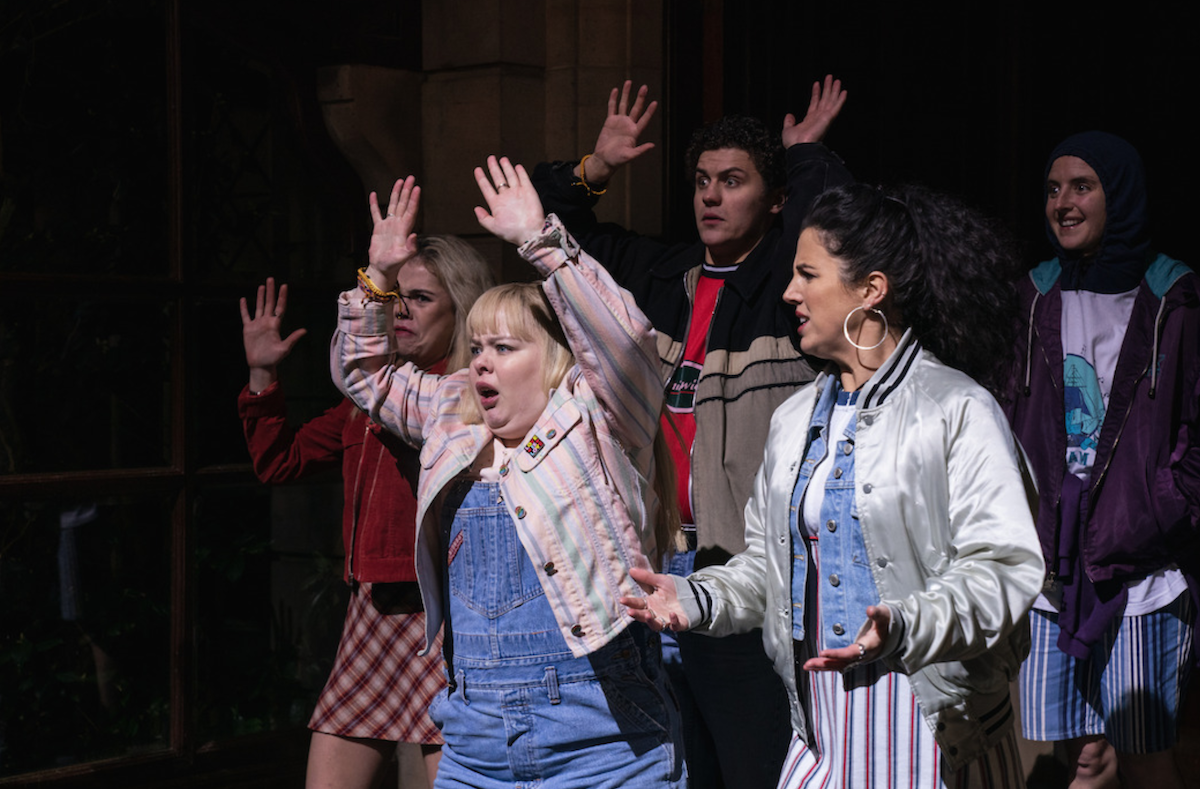 Erin, Clare, Michelle, Orla, and James with their hands up in Derry Girls Season 3