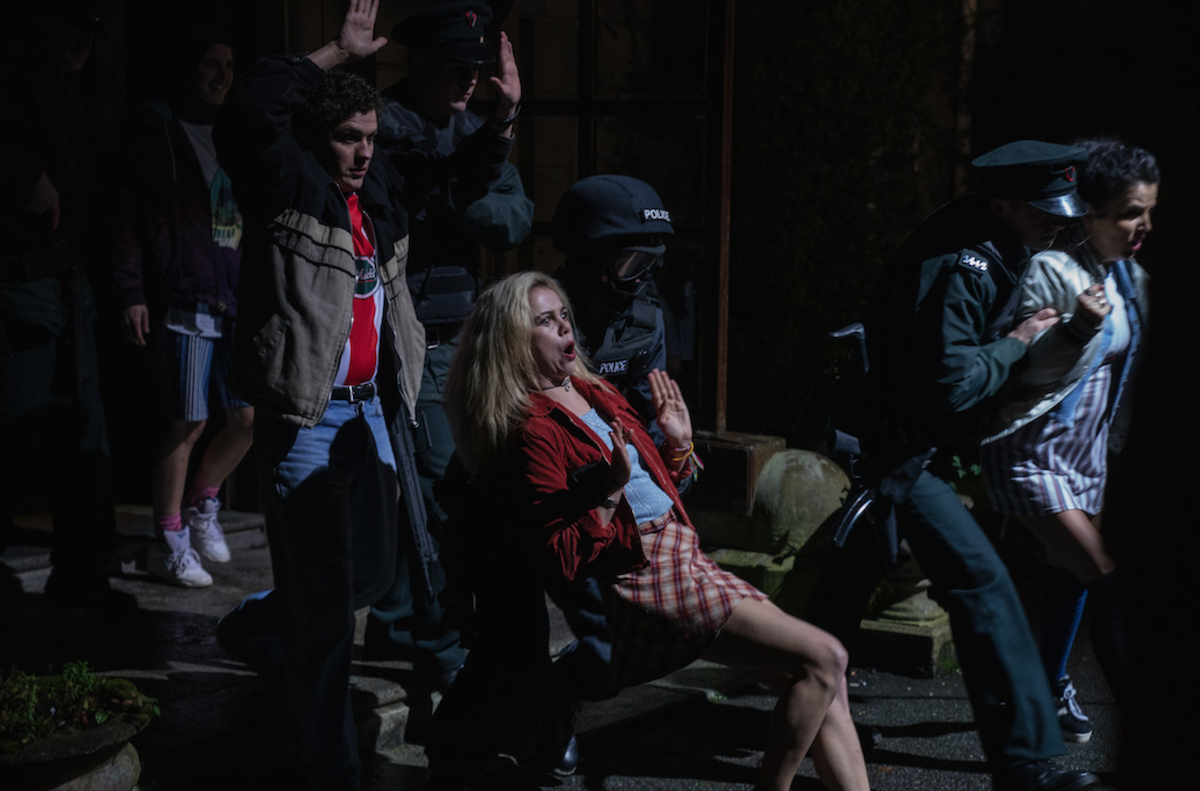 Erin, Orla, and Michelle run from the police in Derry Girls Season 3