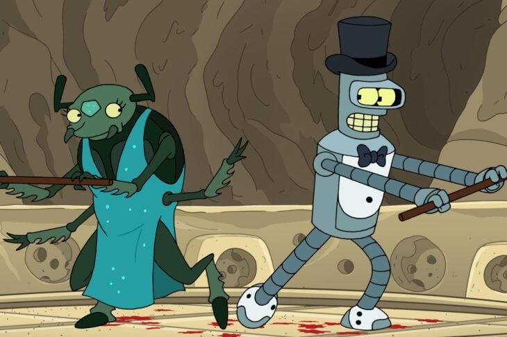 Still from Futurama Season 11 Episode 4 of Bender in a top hat and tuxedo style garments and an Alien in a fancy dress doing a tap dance number on a round table with splatters of blood on it