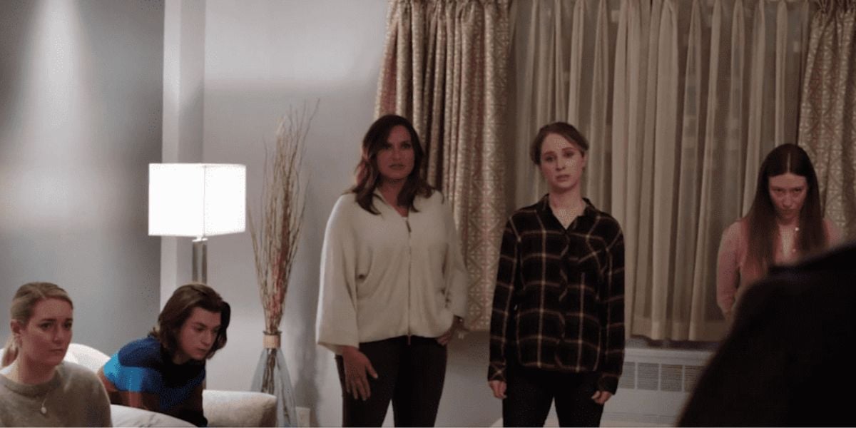 Olivia Benson standing among the Stabler kids in their living room