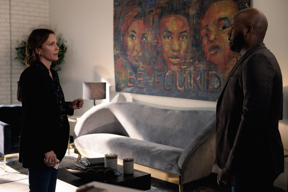 Still from Found Season 1 Episode 4 of Kelli Williams as Margaret Reed and Steven Maurice Jones as Jeff Robinson pictured from left to right.