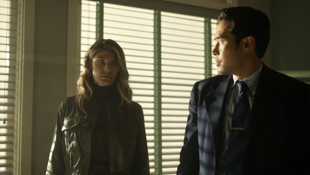Still from Quantum Leap Season 2 Episode 3 of Caitlin Bassett as Addison and Raymond Lee as Dr. Ben Song pictured from left to right