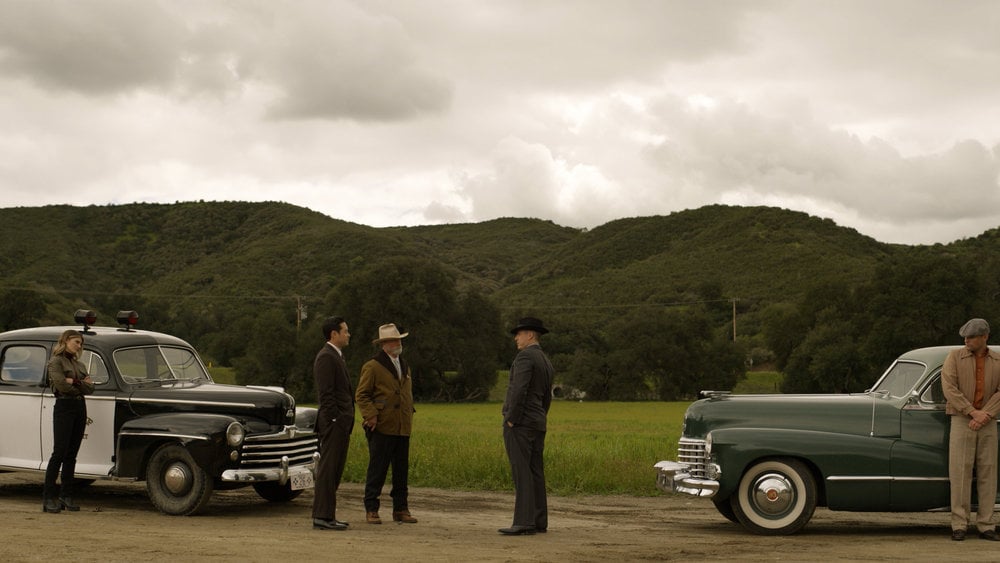 Still from Quantum Leap Season 2 Episode 3 of Caitlin Bassett as Addison, Raymond Lee as Dr. Ben Song, Louis Herthum as Sheriff Woodrow Morgan, and William DeVry as General Austin Murray pictured from left to right.