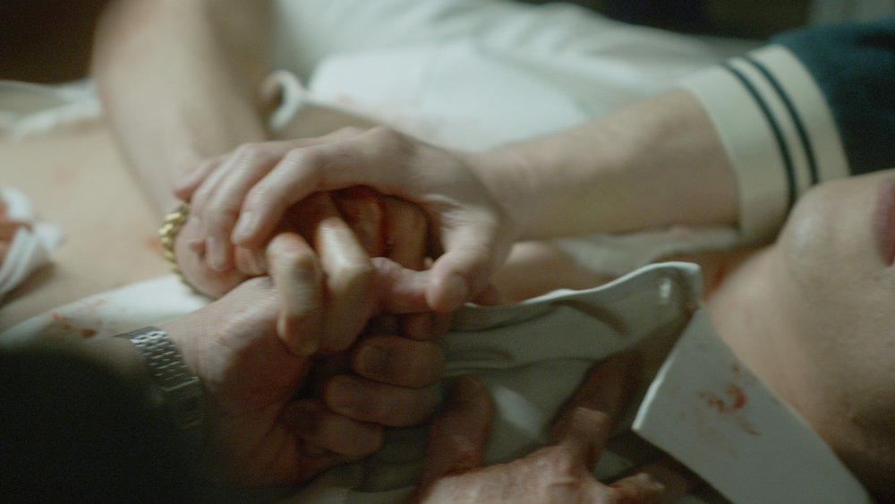 Still from Quantum Leap Season 2 Episode 5 of joined hands.