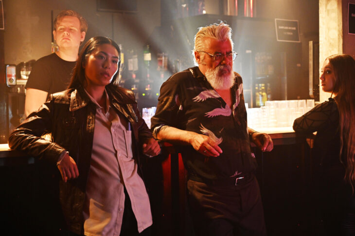 Still from Van der Valk Season 3 episode Magic in Amsterdam Part three of Django Chan-Reeves as Citra Li and Darrell D'Silva as Hendrik Davie.