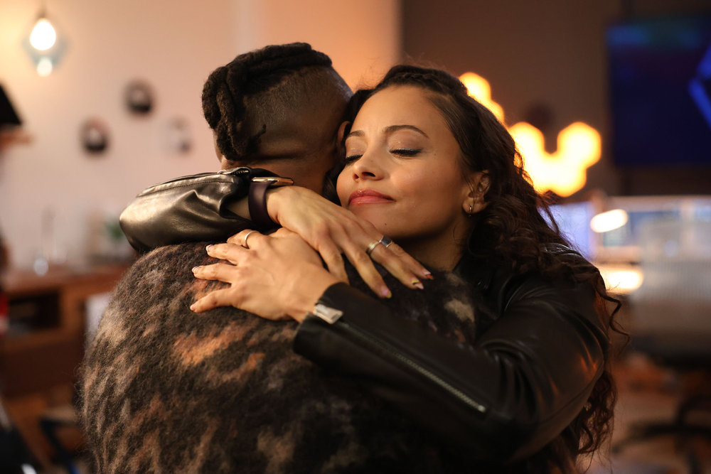 Still from Found Season 1 Episode 10 of Gabrielle Elise Walsh as Lacey Quinn hugging Zeke who's back is to the camera.