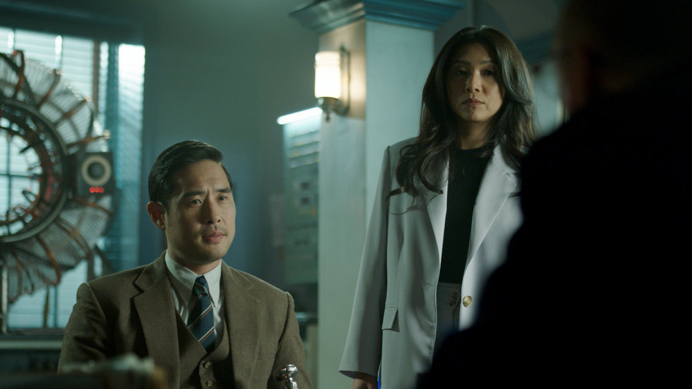 Still from Quantum Leap Season 2 Episode 6 of Raymond Lee as Dr. Ben Song and Nanrisa Lee as Jenn pictured from left to right