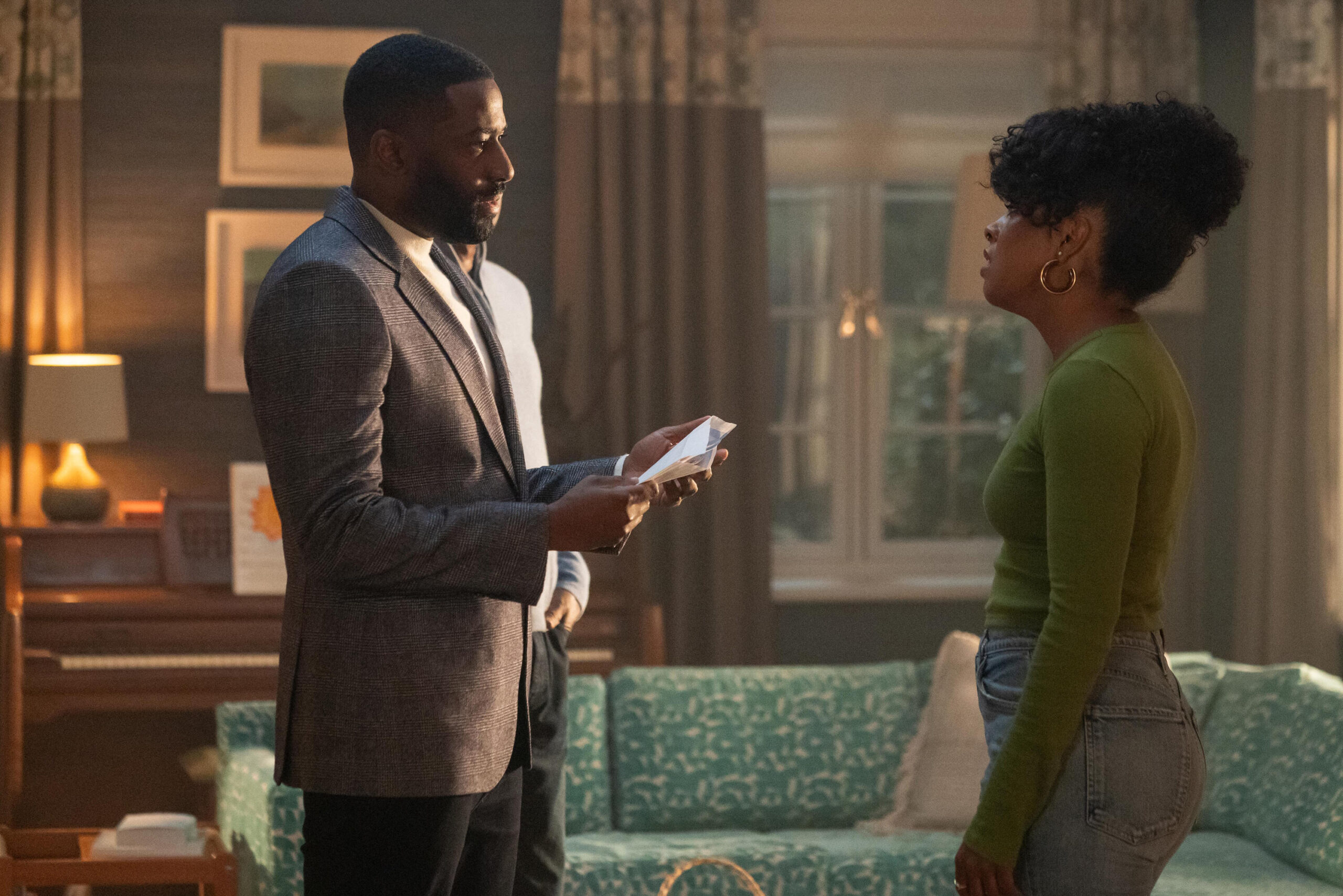 Still from Black Cake Season 1 Episode 6 of Ashley Thomas as Byron and Adrienne Warren as Benny pictured from left to right