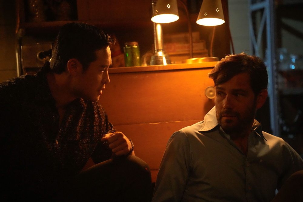 Still from Quantum Leap Season 2 Episode 9 of Raymond Lee as Dr. Ben Song and David Clayton Rogers as Kevin pictured from left to right.
