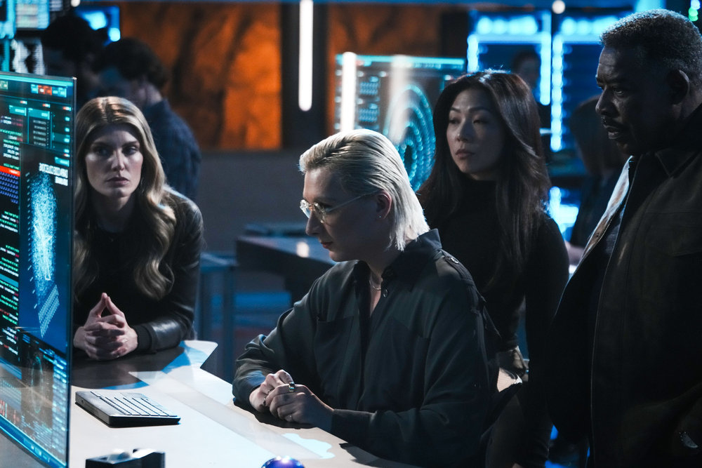 Still from Quantum Leap Season 2 Episode 9 of Caitlin Bassett as Addison, Mason Alexander Park as Ian, Nanrisa Lee as Jenn, and Ernie Hudson as Magic pictured from left to right.