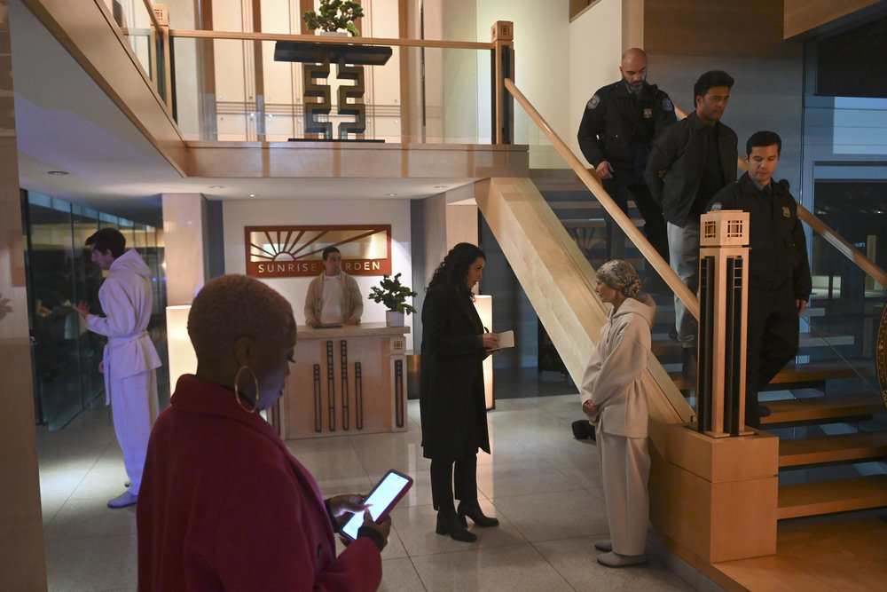 Still from The Irrational Season 1 Episode 9 of Travina Springer as Kylie, Paloma Nozicka as Morgan, patient, police, and Steven Allerick as Vincent Lee pictured from left to right.