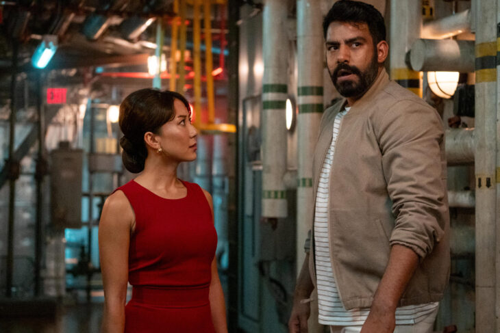 Still from Death and Other Details Season 1 Episode 4 of Angela Zhou as Teddy Goh and Rahul Kohli as Sunil Ranja pictured from left to right,