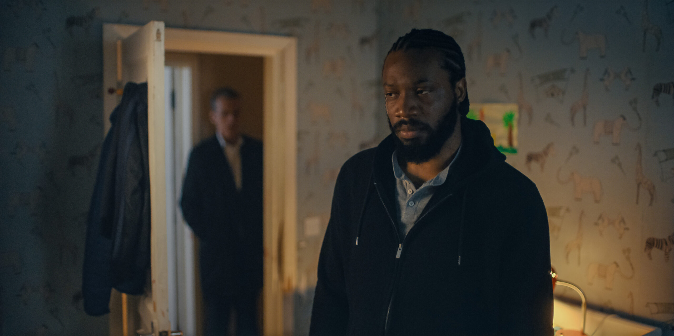 Still from Criminal Record Season 1 Episode 7 of Peter Capaldi and Tom Moutchi pictured from left to right.