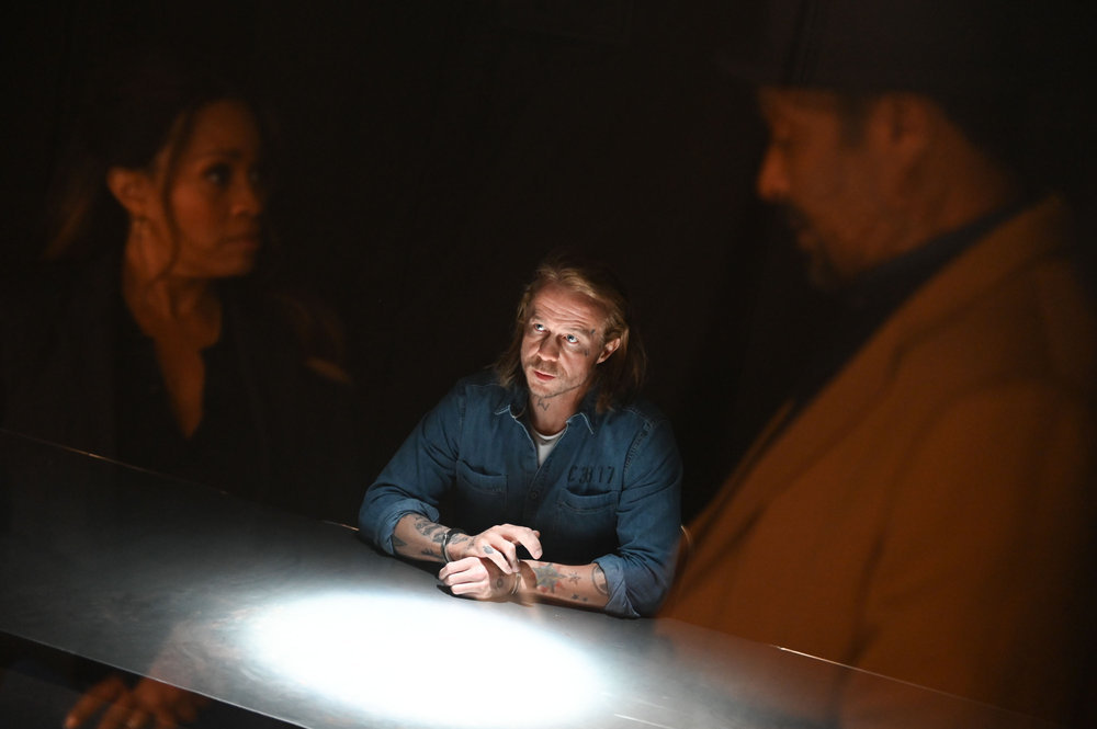 Still from The Irrational Season 1 Episode 11 of Maahra Hill as Marisa, Steven Roberts as James Belfast, and Jesse L. Martin as Alec Mercer pictured from left to right.
