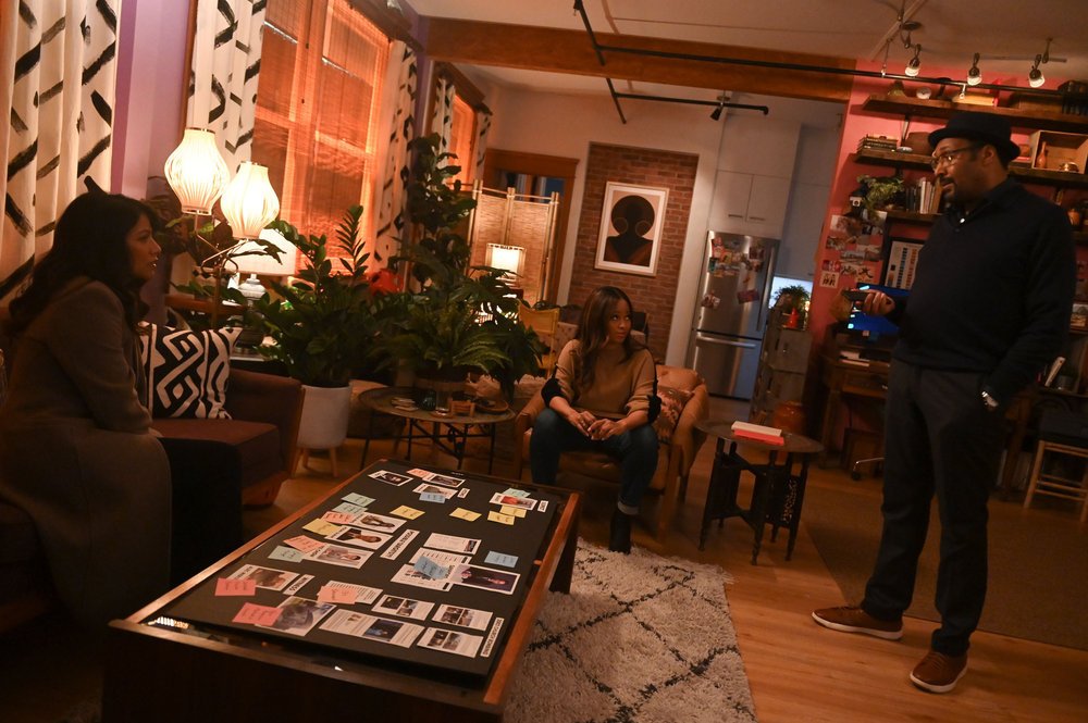 Still from The Irrational Season 1 Episode 11 of Karen David as Rose Dinshaw, Maahra Hill as Marisa, and Jesse L. Martin as Alec Mercer pictured from left to right.