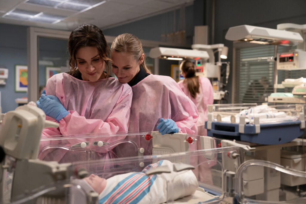 Station 19 Season 7 Episode 1 - Maya and Carina with a baby - STEFANIA SPAMPINATO, DANIELLE SAVRE