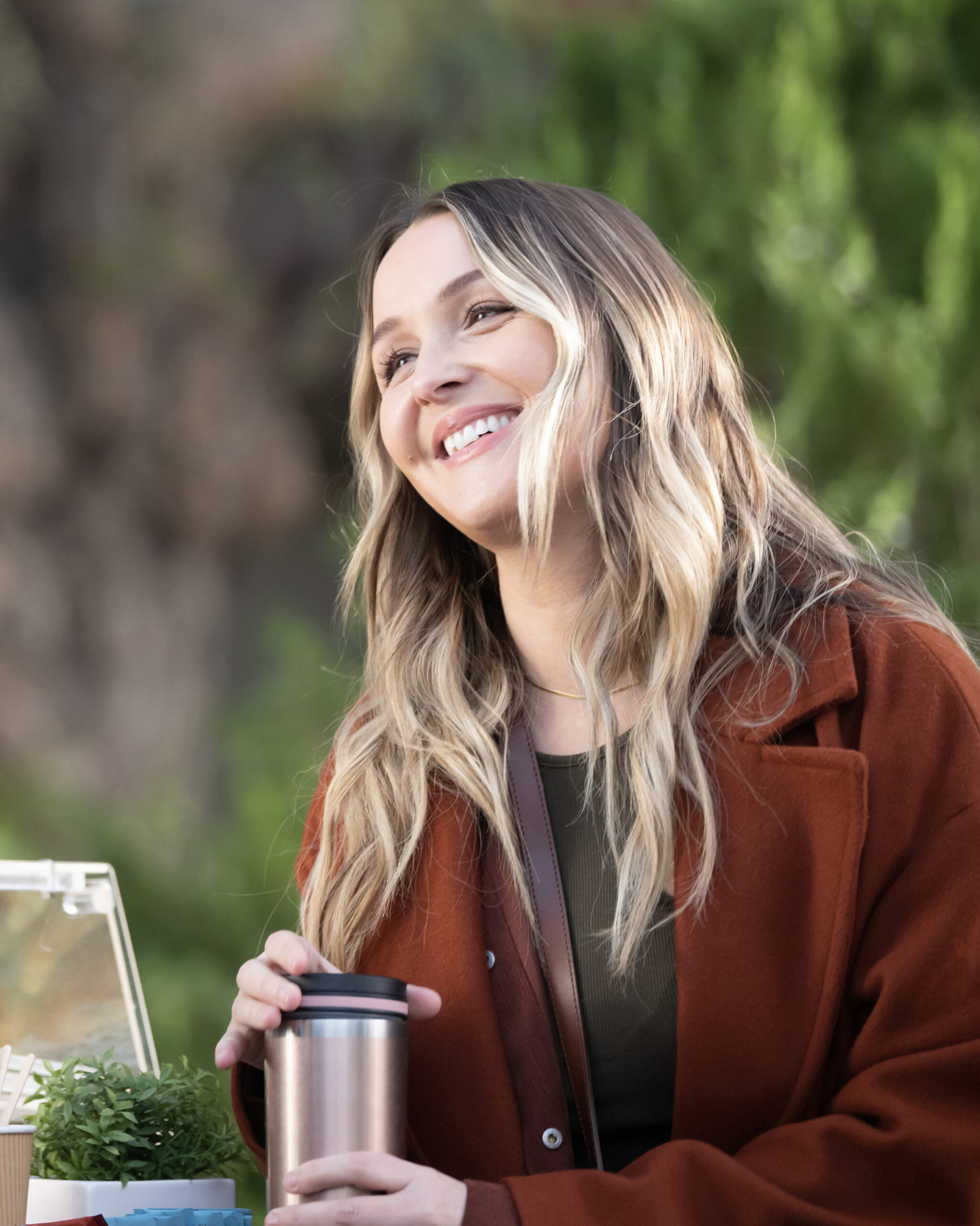 CAMILLA LUDDINGTON as Jo Wilson, smiling with coffee, on Grey's Anatomy Season 20 Episode 2, "Keep the Family Close."