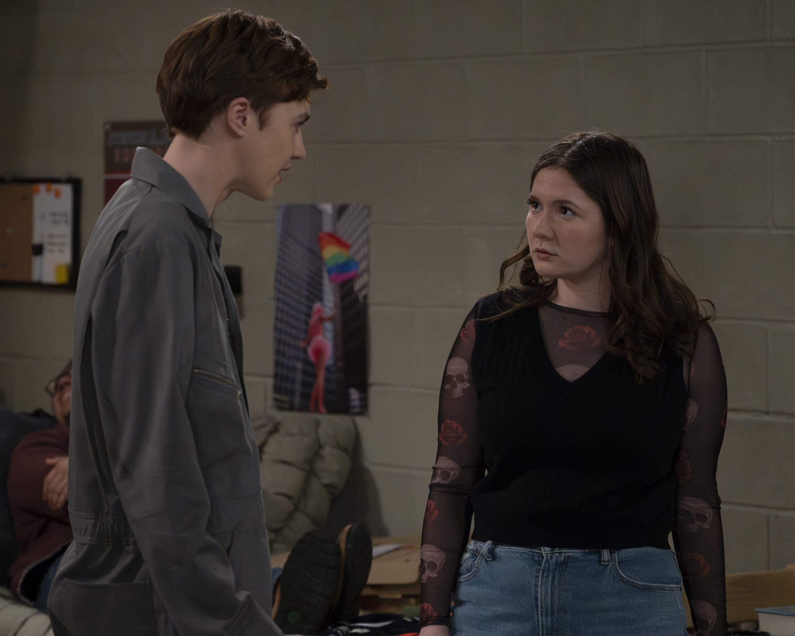 AMES MCNAMARA, EMMA KENNEY | Tell-Tale TV The Conners Season 6 Episode 6 - AMES MCNAMARA, EMMA KENNEY discuss something while standing in Mark's dorm room at college.