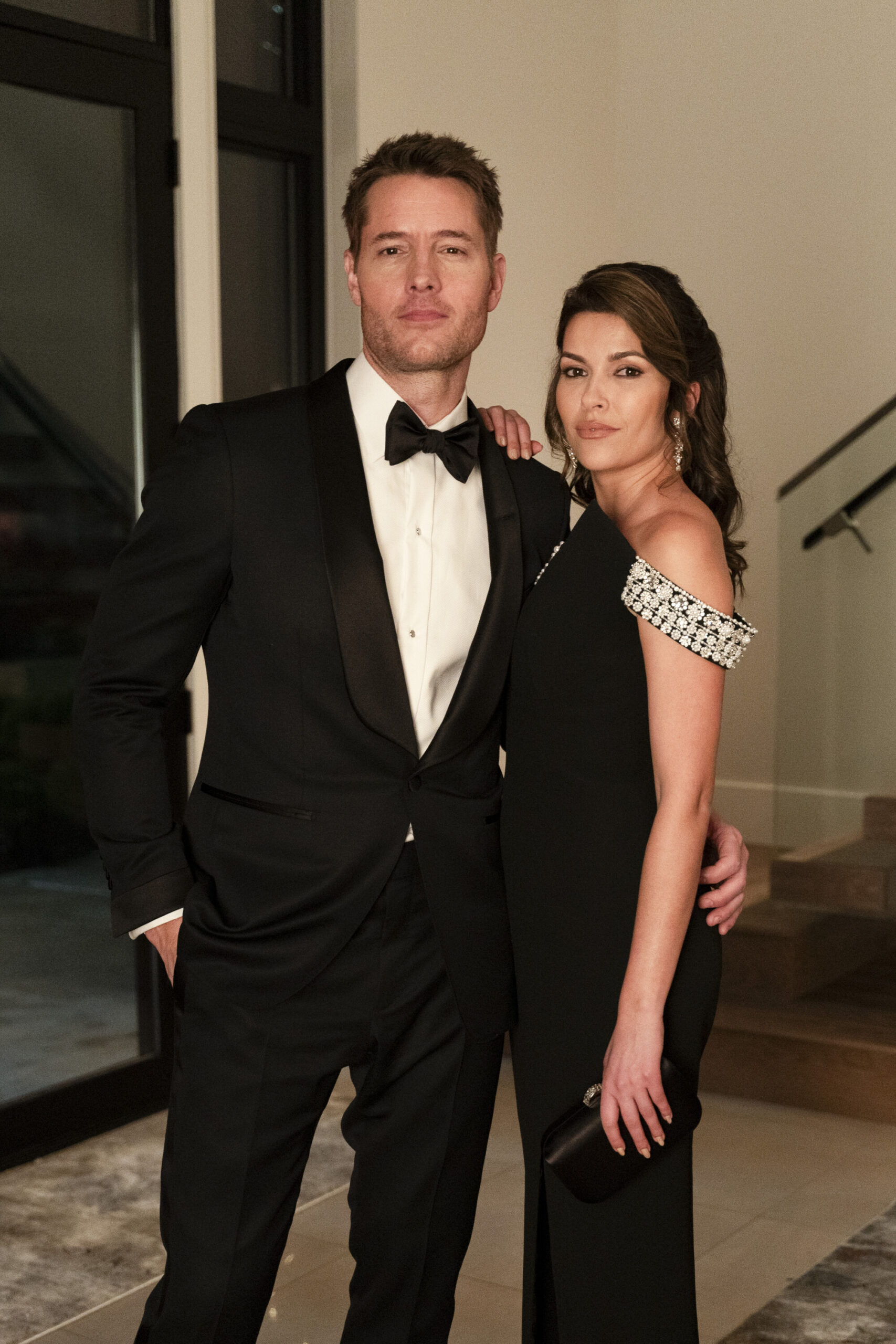 Justin Hartley and wife Sofia Pernas posing together, dressed up for Tracker Season 1 Episode 6