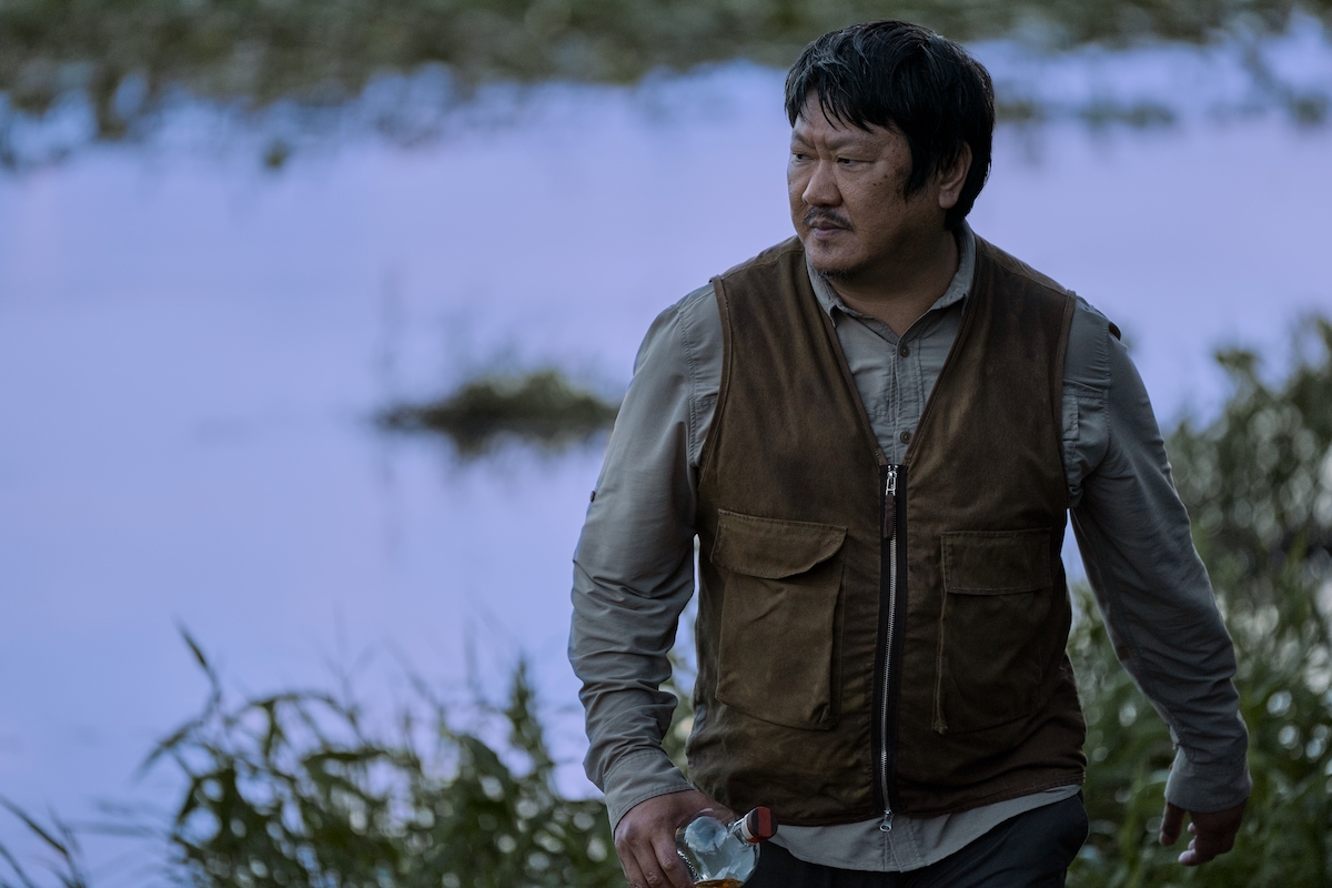 3 Body Problem Season 1 Episode 8 Benedict Wong as Da Shi outside by a body of water