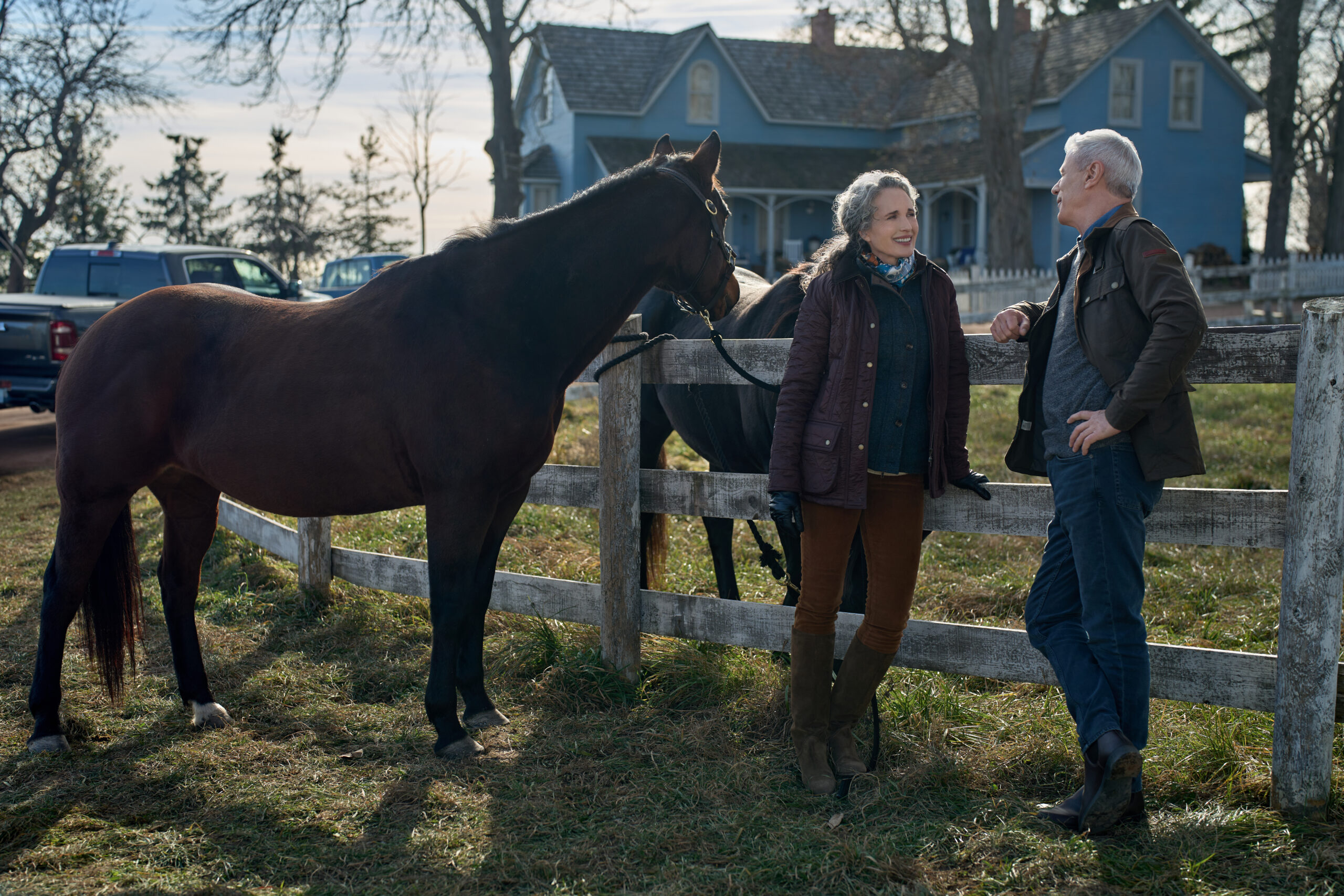 Andie MacDowell as Del, Rob Stewart as Sam, at the fence with the horses, on The Way Home Season 2 Episode 10