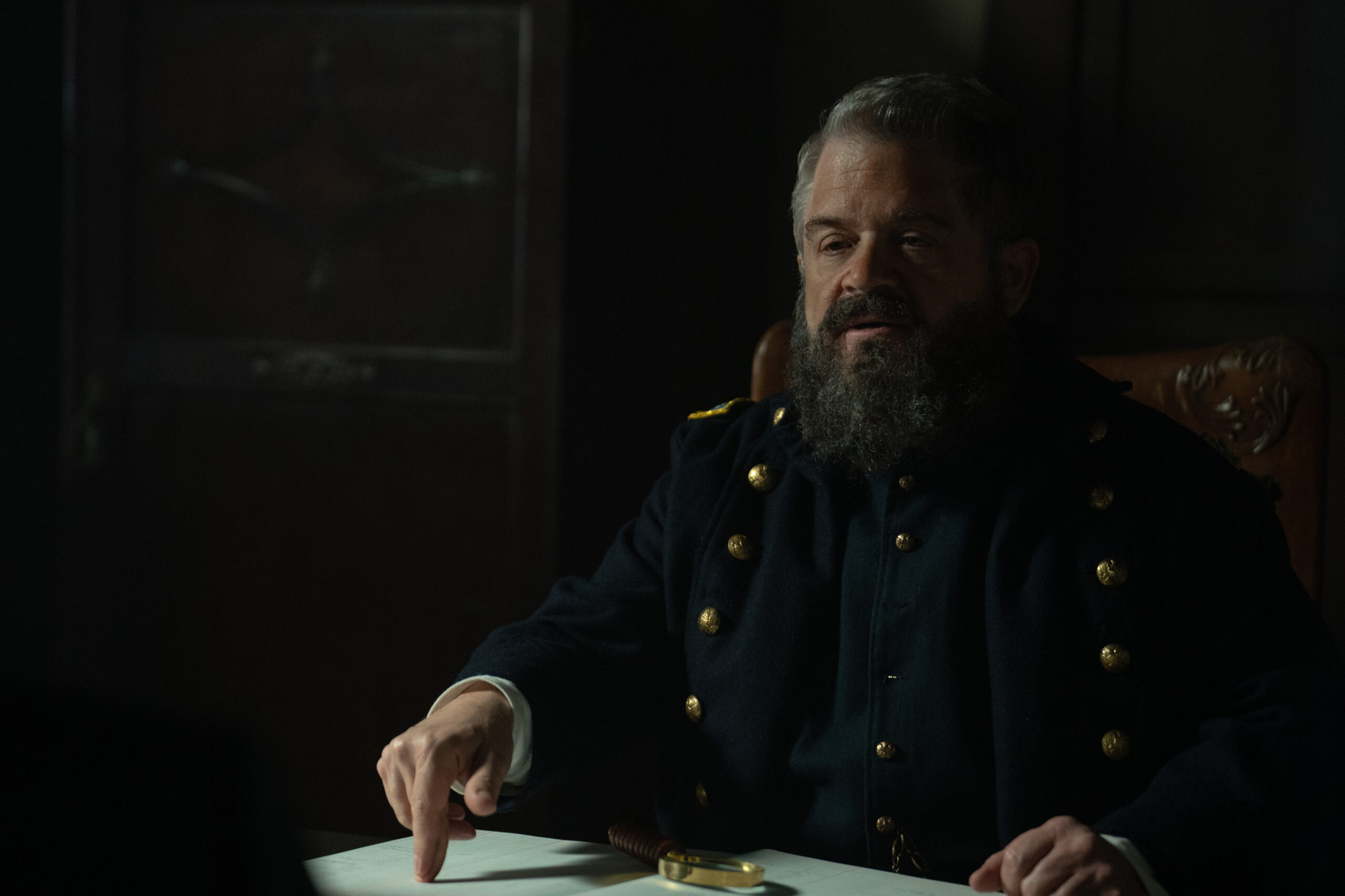 Still from Manhunt Season 1 Episode 3 of Patton Oswald as Detective Lafayette Baker in a medium shot wearing a Union uniform.