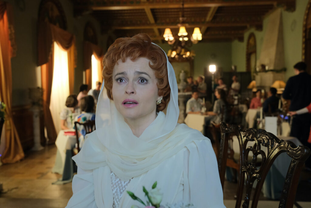 NOLLY Season 1 Episode Three Noele Gordon (Nolly) facing the camera, backdrop is a restaurant