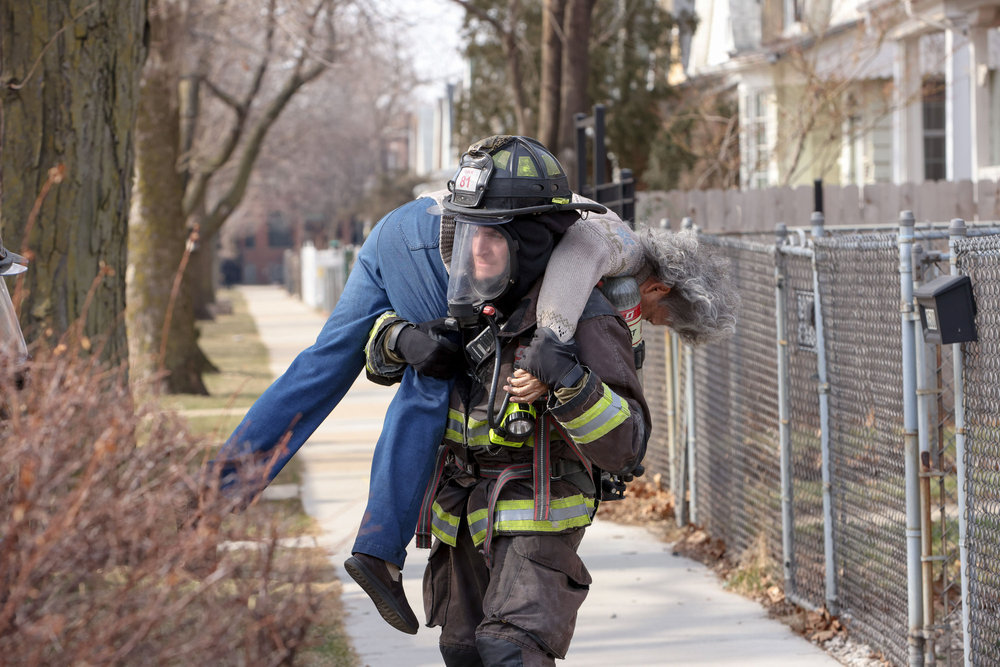 Chicago Fire Season 12 Episode 7, titled Red Flag. Carver carries a victim.