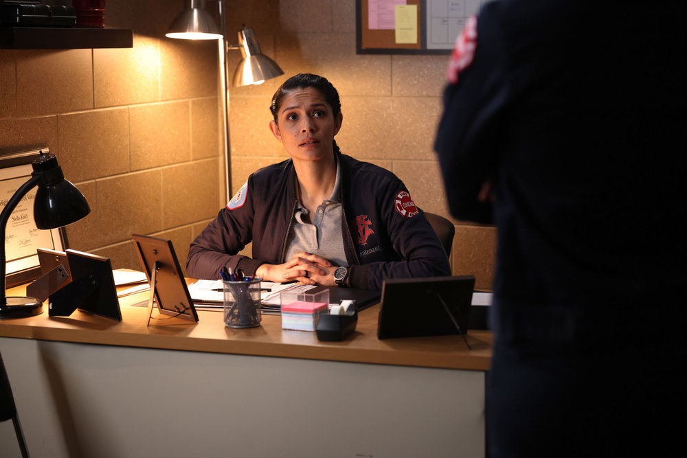 Stella Kidd sits at her desk on Chicago Fire Season 12 Episode 7, "Red Flag."
