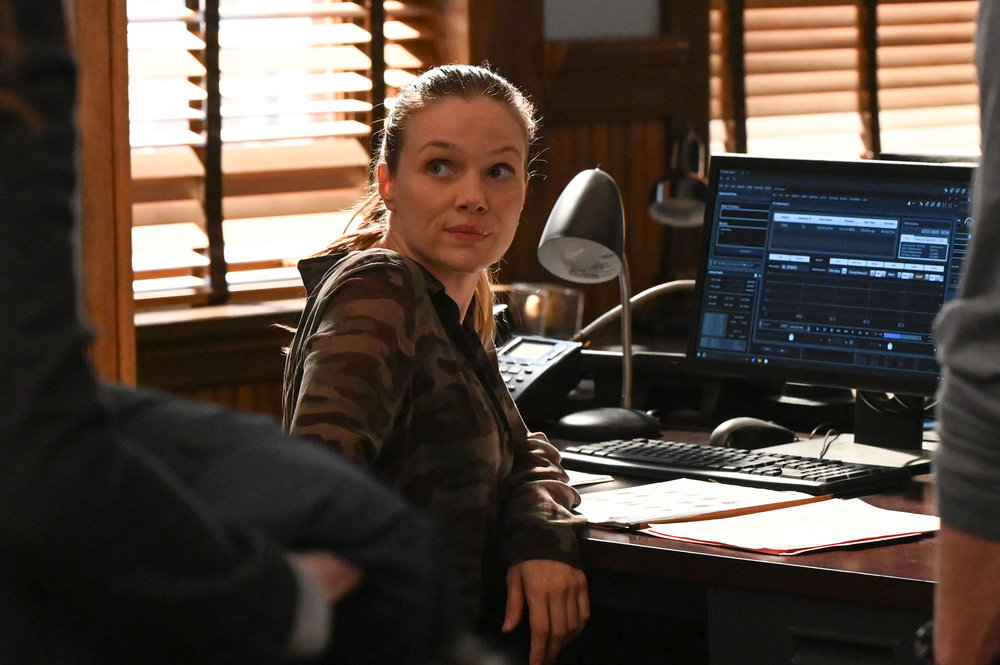Chicago P.D. - Season 11 | Tell-Tale TV Upton sitting at her desk in front of her computer.