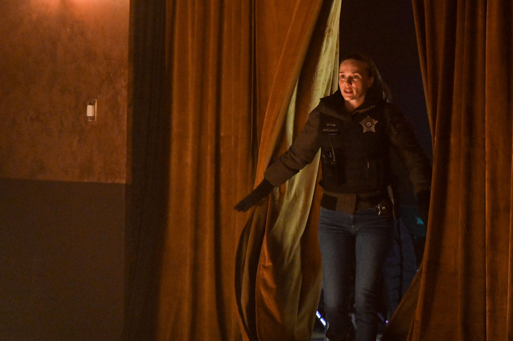 Chicago P.D. - Season 11 | Tell-Tale TV Upton walking into a room through curtains.