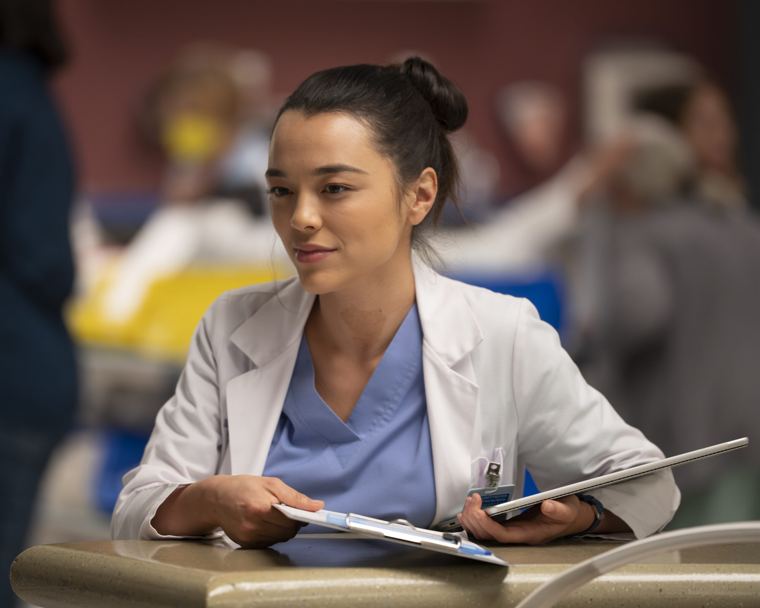 Midori Francis as Mika Yasuda on Grey's Anatomy Season 20 Episode 4, in scrubs with a tablet