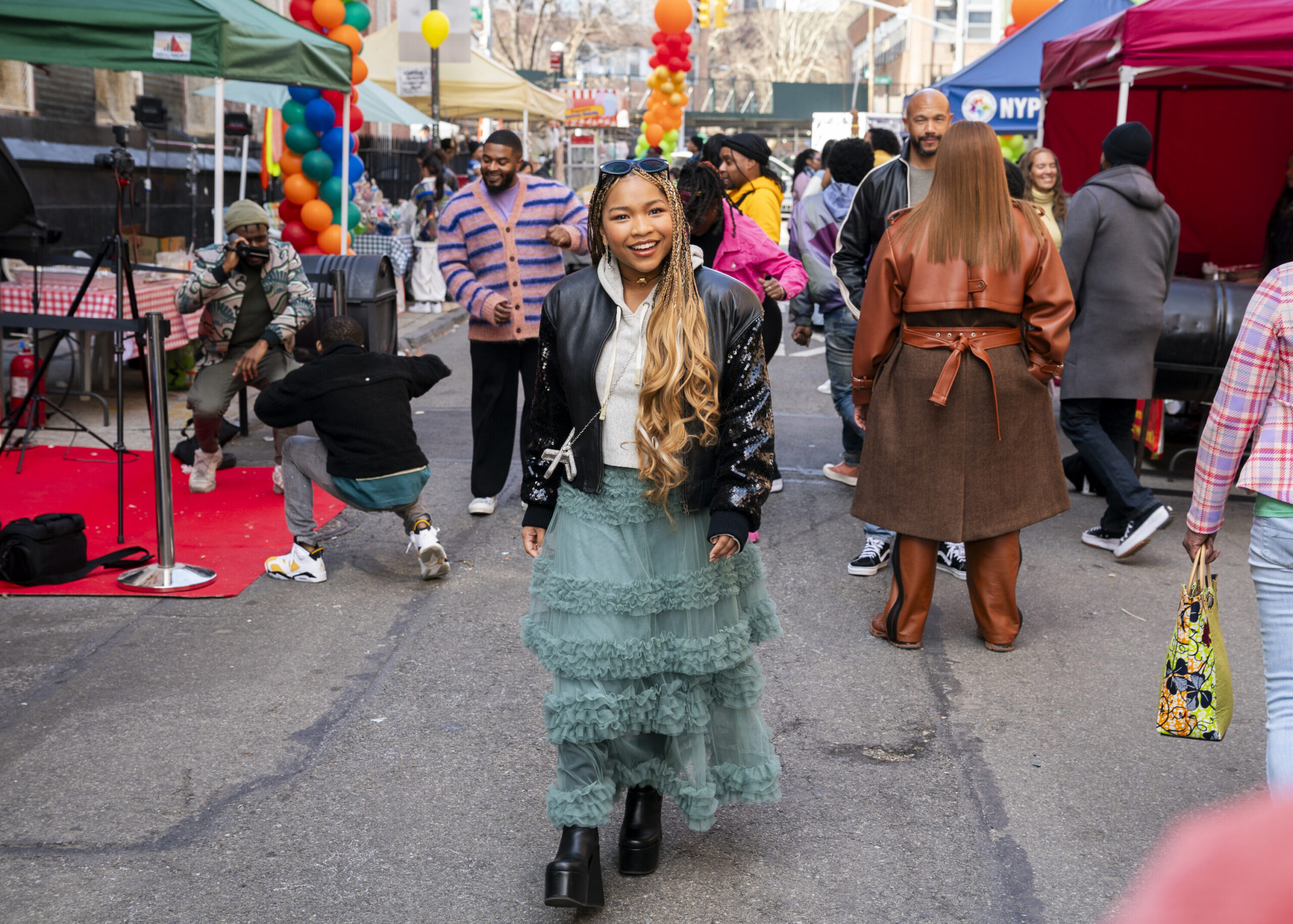 Delilah walking in the middle of the street at the block party.