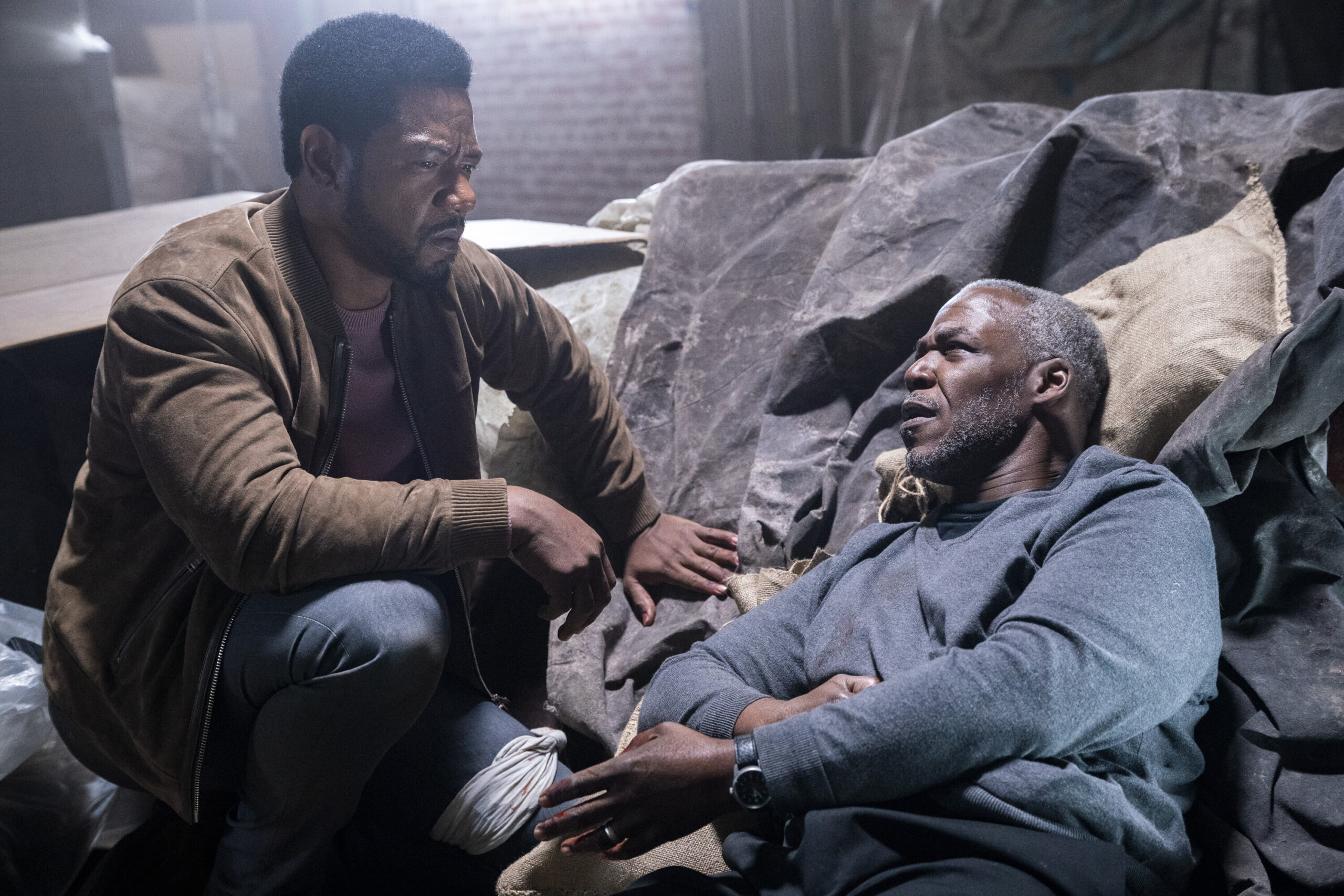 Dante talking to his father who is laying on the floor with a gunshot wound.