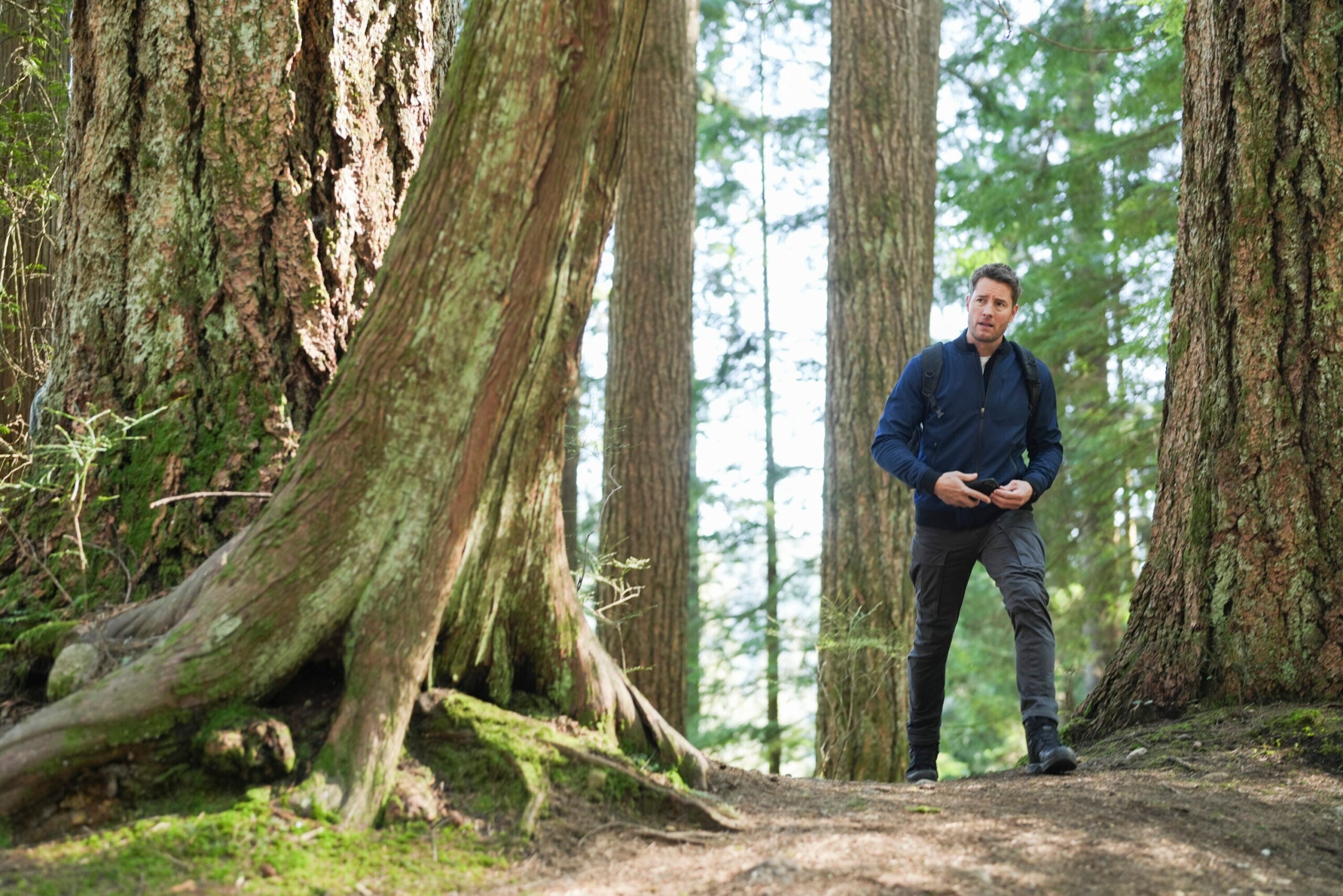 Tracker Season 1 Episode 10 - Into the Wild - Justin Hartley as Colter Shaw in the woods