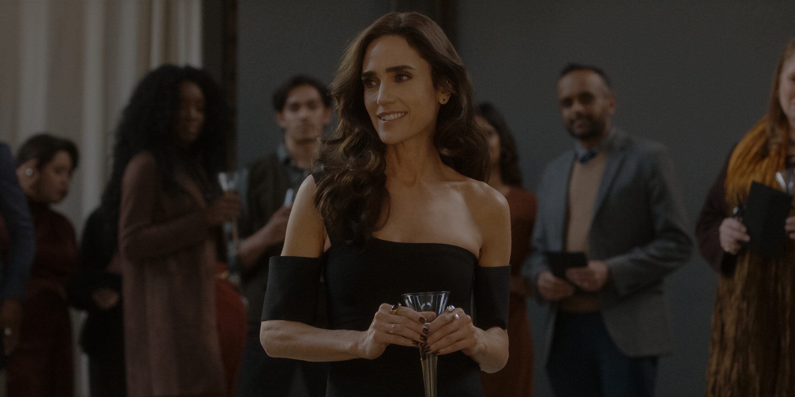 Dark Matter Season 1 Episode 2 - Jennifer Connelly | Tell-Tale TV Still from Dark Matter Season 1 Episode 2 of Jennifer Connelly wearing a black sleeveless dresses holding a glass.