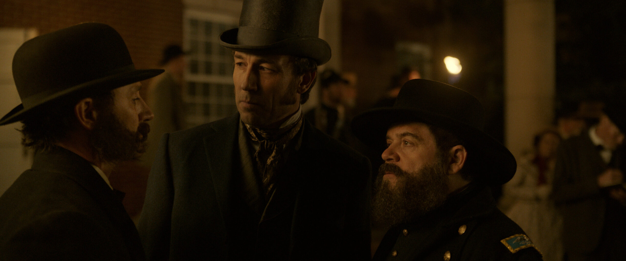 Still from Manhunt Season 1 Episode 7 of Josh Stewart, Tobias Menzies and Patton Oswalt pictured from left to right.