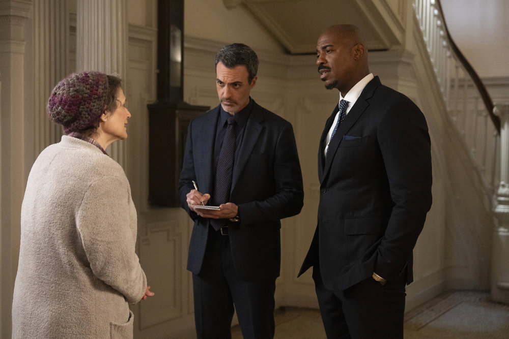 Law & Order Season 23 Episode 9 - Anita Hollander as Margaret Rayfield discusses what she witnessed with Reid Scott as Det. Vincent Riley and Mehcad Brooks as Det. Jalen Shaw.