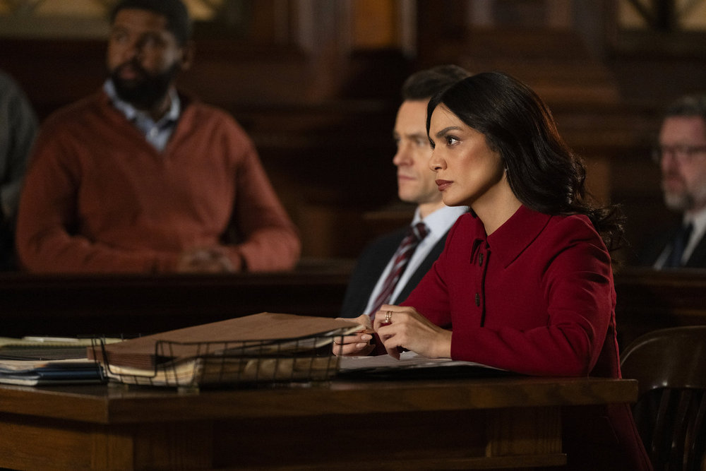 Law & Order Season 23 Episode 9 - Hugh Dancy as ADA Nolan Price sits with Odelya Halevi as ADA Samantha Maroun in court.