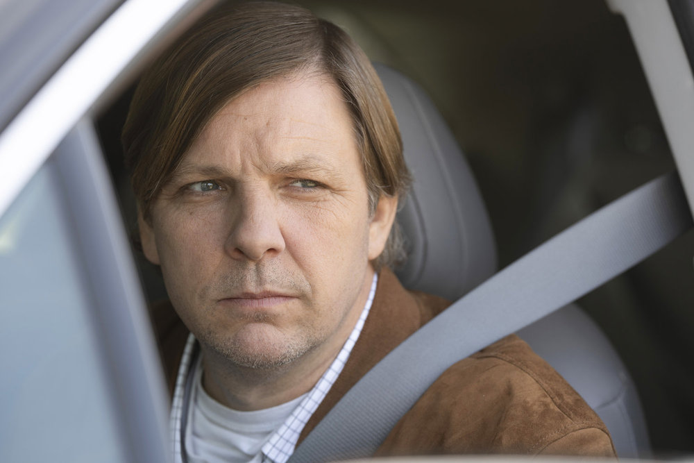 Law & Order: Organized Crime Season 4 Episode 9 - Tobias Forrest as Darian Morse sitting in a car.