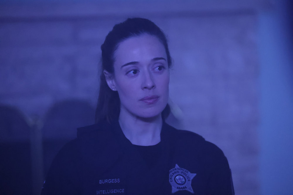 Chicago P.D. Season 11 Episode 10 - Marina Squerciati as Kim Burgess stands with a neutral, but serious look on her face.