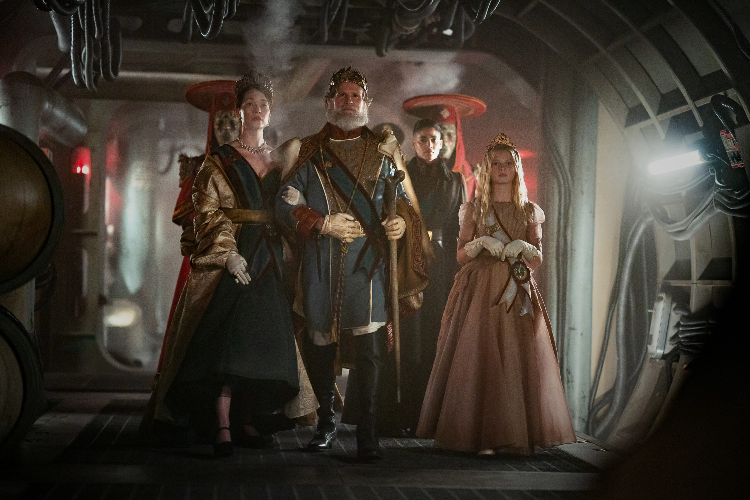 Still from Rebel Moon Part Two of Rhian Rees as The Queen, Cary Elwes as The King, Sofia Boutella as Kora and Stella Grace Fitzgerald as Princess Issa pictured from left to right.
