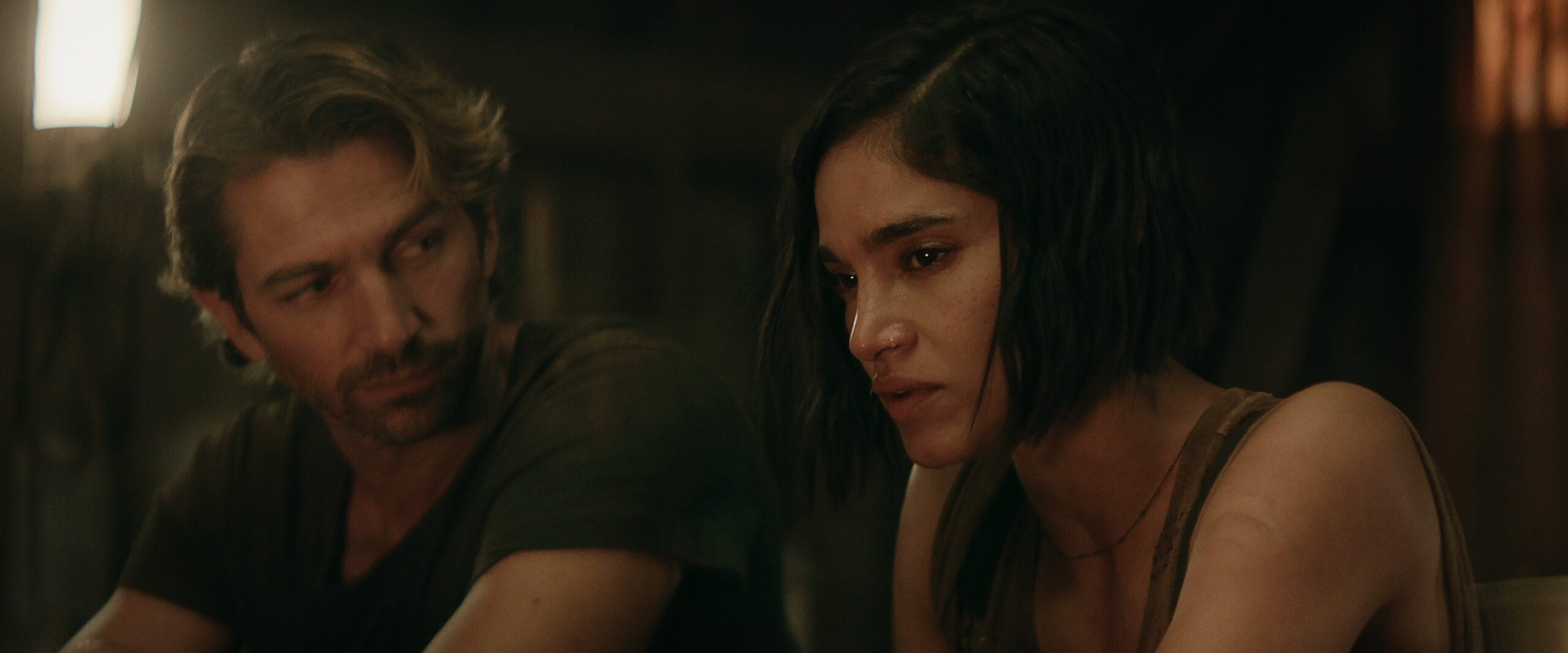 Still from Rebel Moon Part Two of Michiel Huisman as Gunnar and Sofia Boutella as Kora pictured from left to right.