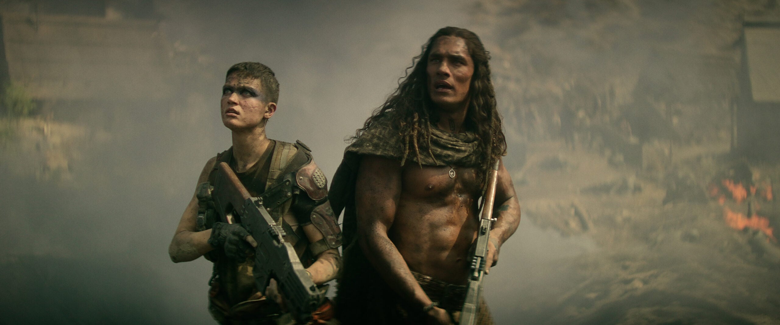 Still from Rebel Moon Part Two of Elise Duffy as Milius and Staz Nair as Tarak pictured from left to right.