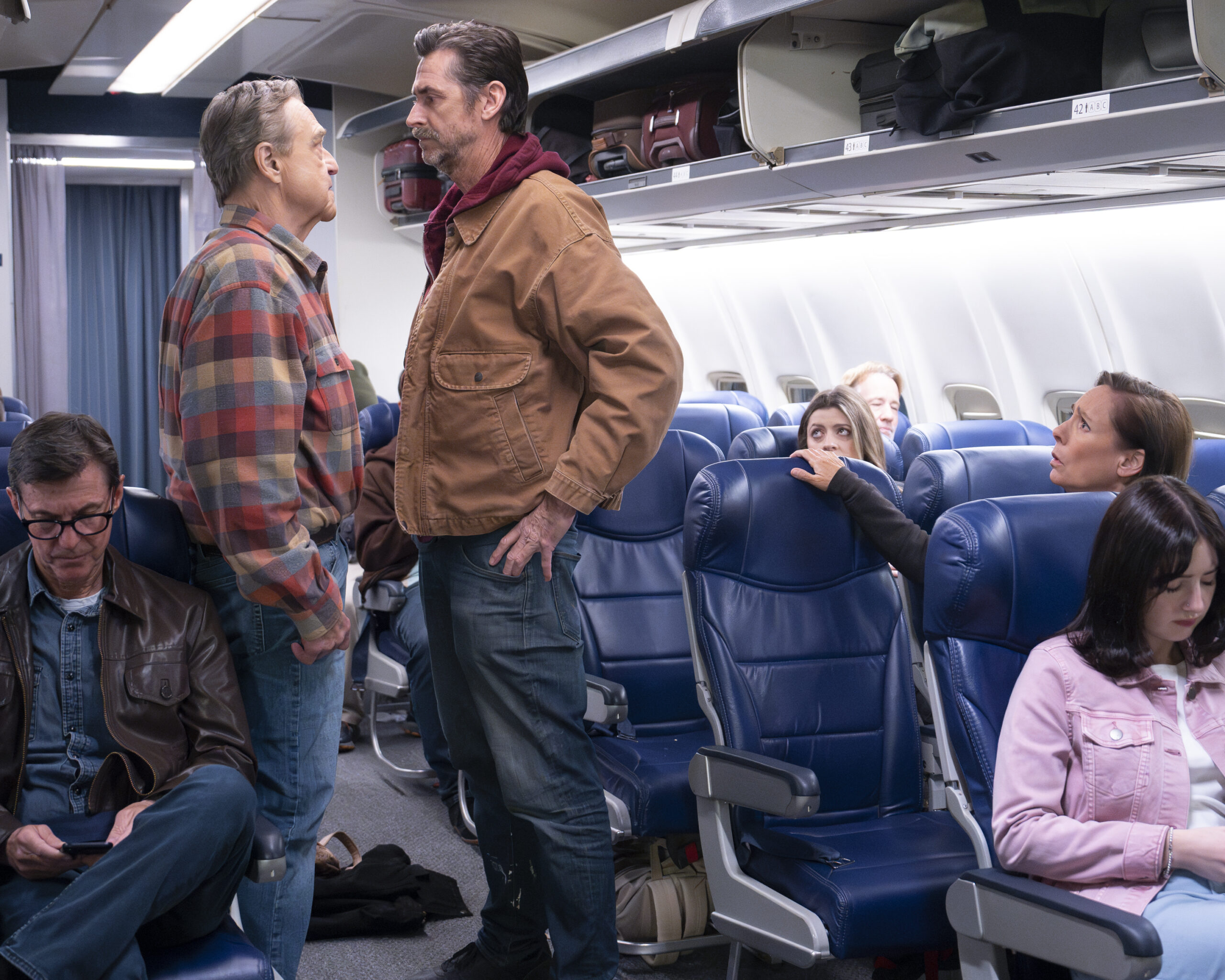 JOHN GOODMAN, KIRK FOX, LAURIE METCALF | Tell-Tale TV The Conners Season 6 Episode 12 - JOHN GOODMAN gets into a disagreement with KIRK FOX on a plane as LAURIE METCALF looks on.
