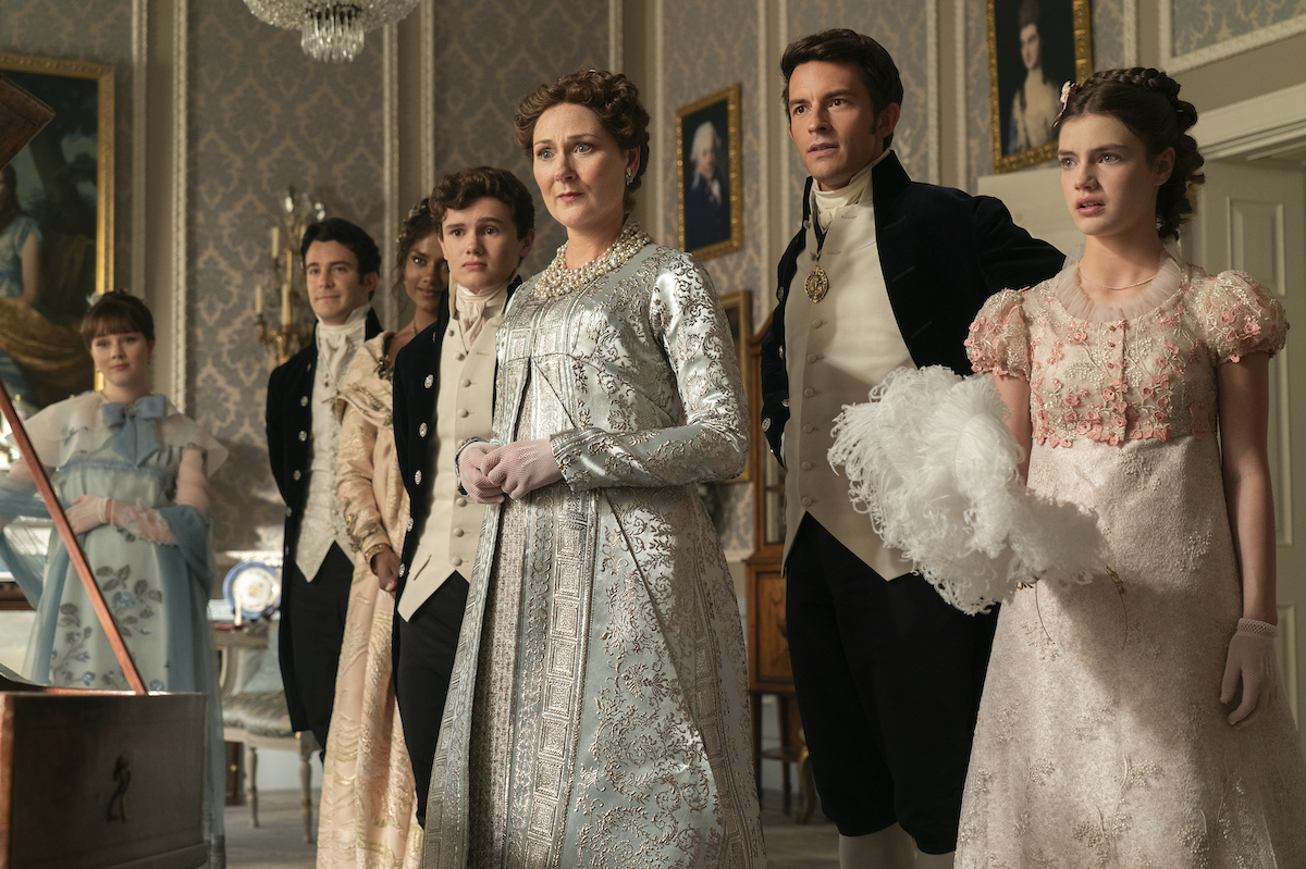 BRIDGERTON Season 3 Episode 1 Claudia Jessie as Eloise Bridgerton, Luke Thompson as Benedict Bridgerton, Simone Ashley as Kate Sharma, Will Tilston as Gregory Bridgerton, Ruth Gemmell as Lady Violet Bridgerton, Jonathan Bailey as Anthony Bridgerton, Florence Hunt as Hyacinth Bridgerton